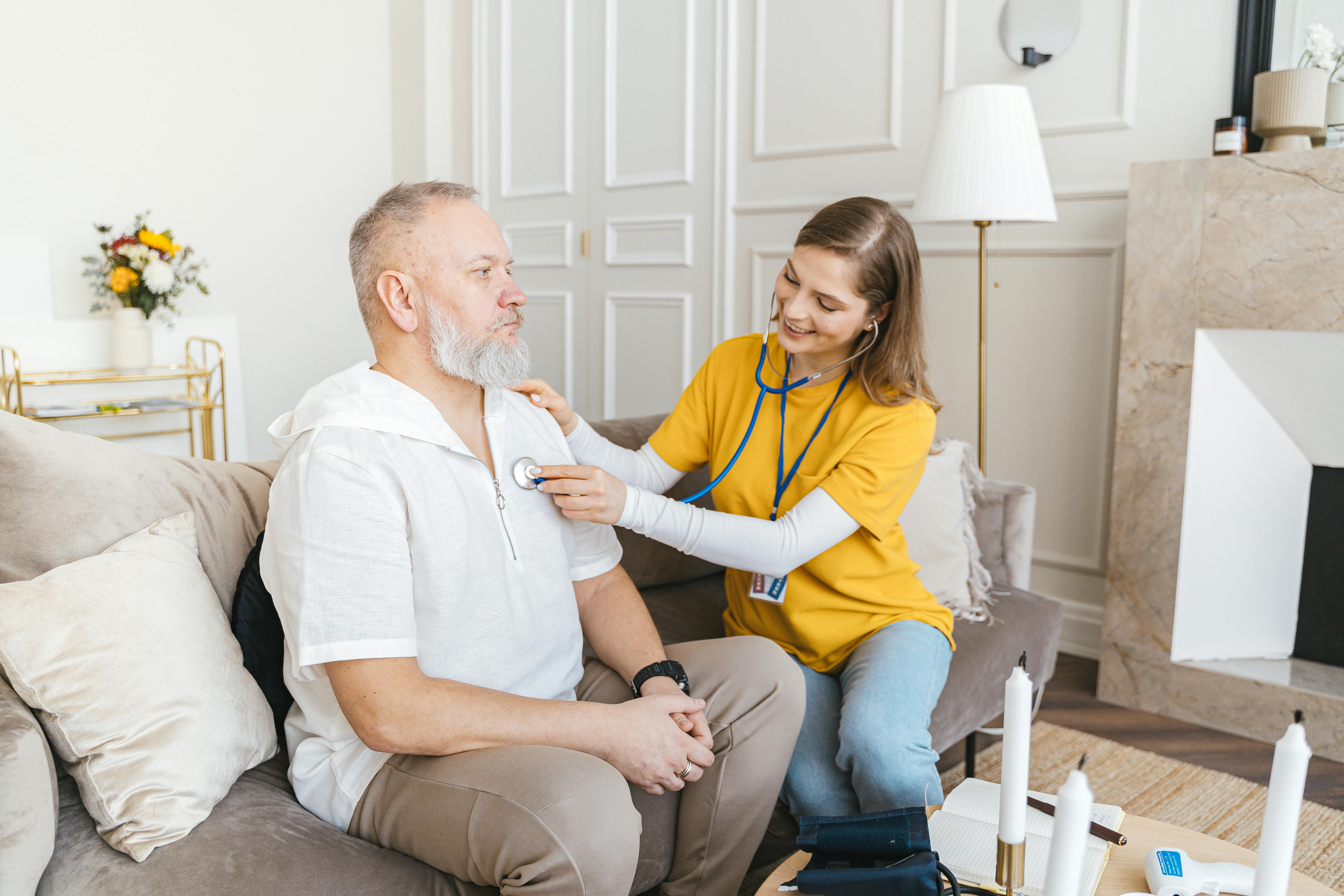Nurse providing home care to patient